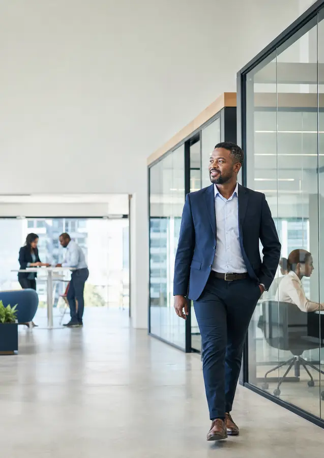 Business professional using a phone in a modern office environment